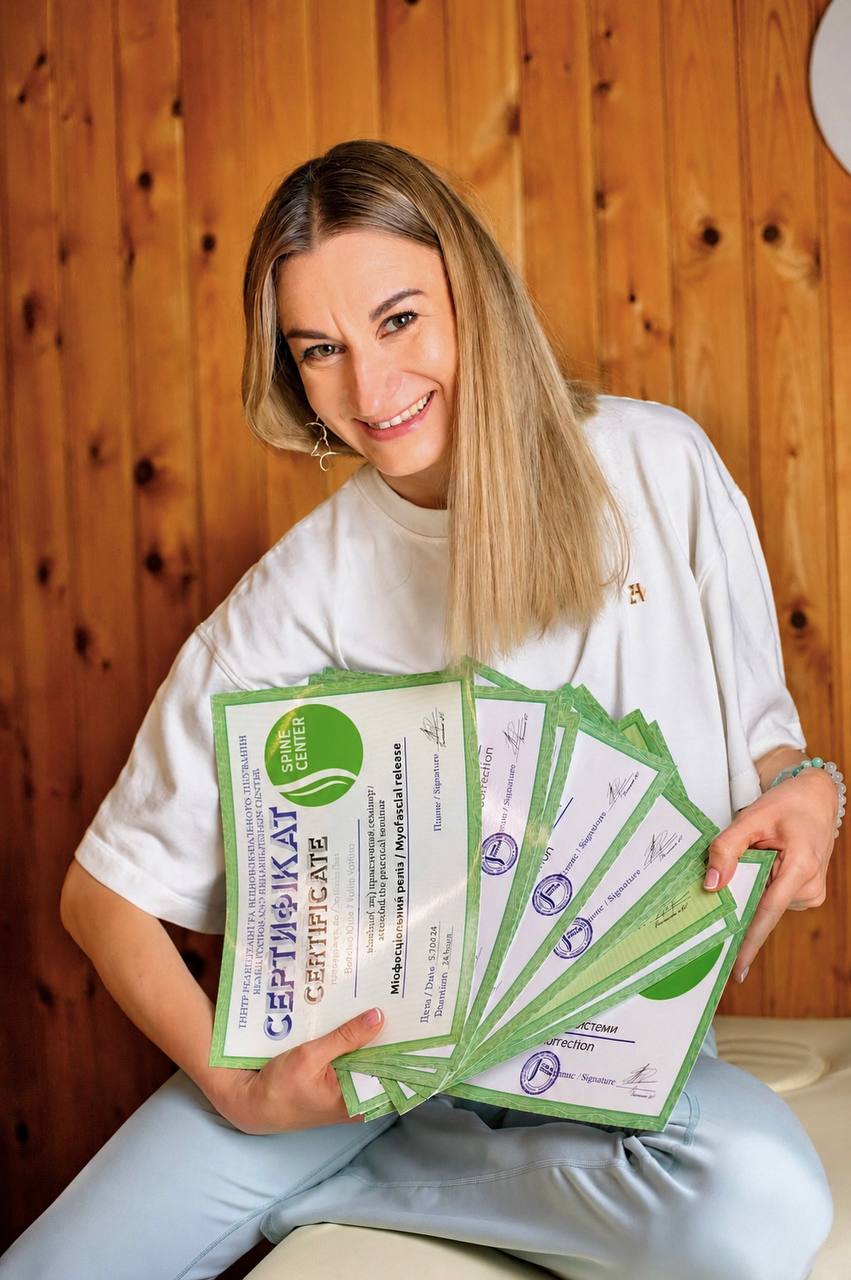 Yuliia Voitina with certificates